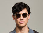 Model is wearing The ZEV CLIP in Gold in size 48 with G-15 Tinted Lenses