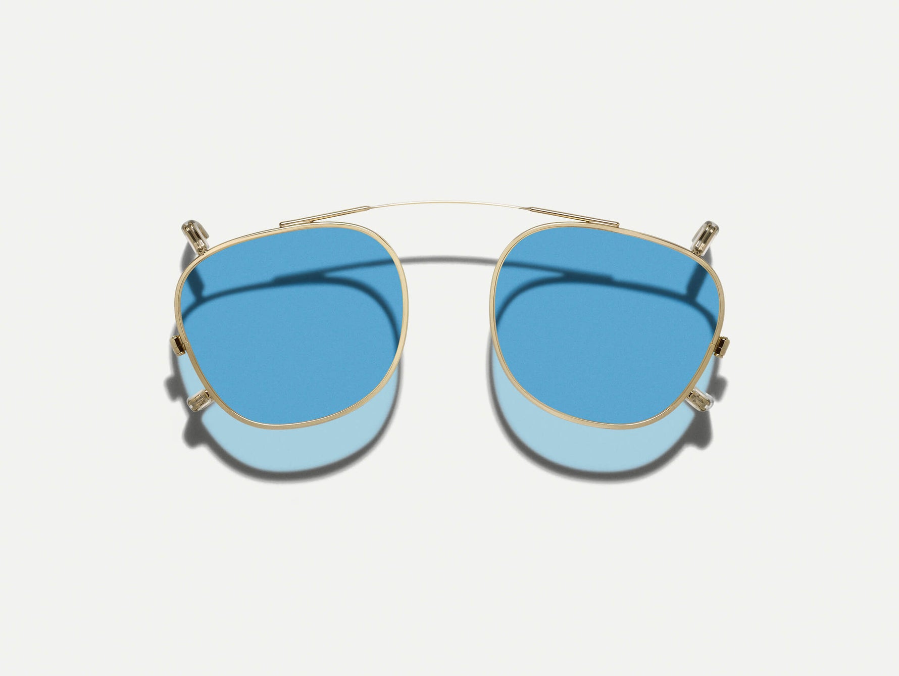 The DAHVEN CLIP in Gold with Celebrity Blue Tinted Lenses