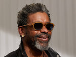 Model is wearing The GATKES SUN in Blonde in size 52 with Denim Blue Tinted Lenses