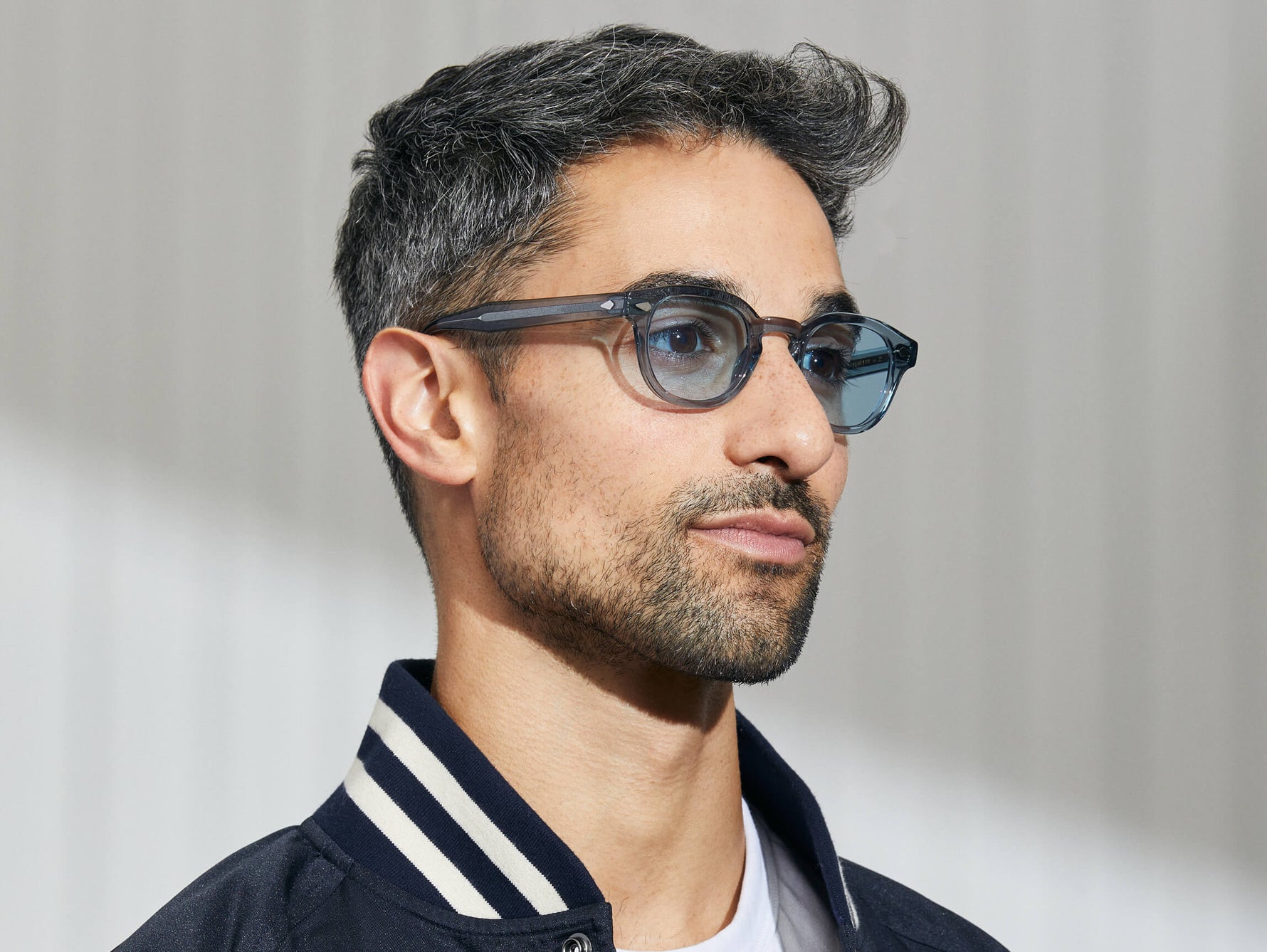 Model is wearing The LEMTOSH in Light Blue in size 46 with Bel Air Blue Tinted Lenses