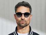 Model is wearing The LEMTOSH in Ink in size 46 with Denim Blue Tinted Lenses