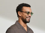 Model is wearing The MILTZEN in Citron/Tortoise in size 46 with GREEN+ Lenses