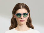 Model is wearing The MILTZEN in Sapphire in size 49 with GREEN+ Lenses