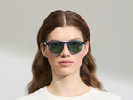 Model is wearing The MILTZEN in Sapphire in size 49 with GREEN+ Lenses