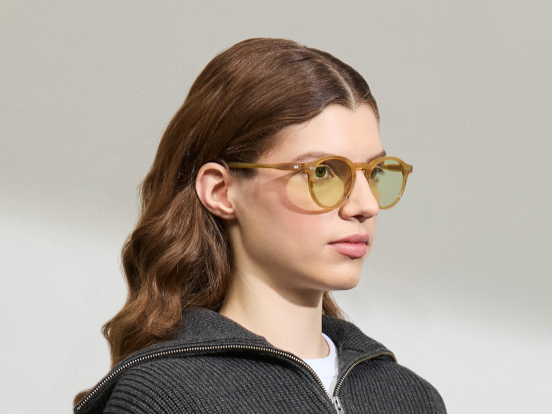 Model is wearing The MILTZEN in Blonde in size 49 with GREEN+ Lenses