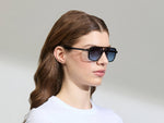 Model is wearing The MINYAN SUN in size 54 in Black with Denim Blue Tinted Lenses