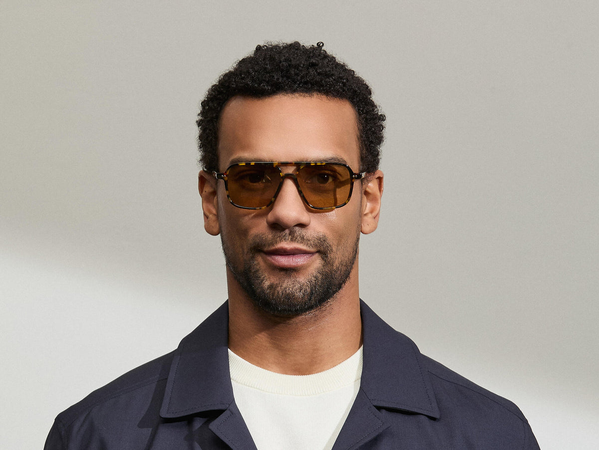 Model is wearing The MINYAN SUN in size 54 in Tortoise with Amber Tinted Lenses