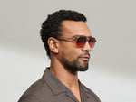 Model is wearing The MINYAN SUN in size 54 in Vintage Rose with Cabernet Tinted Lenses